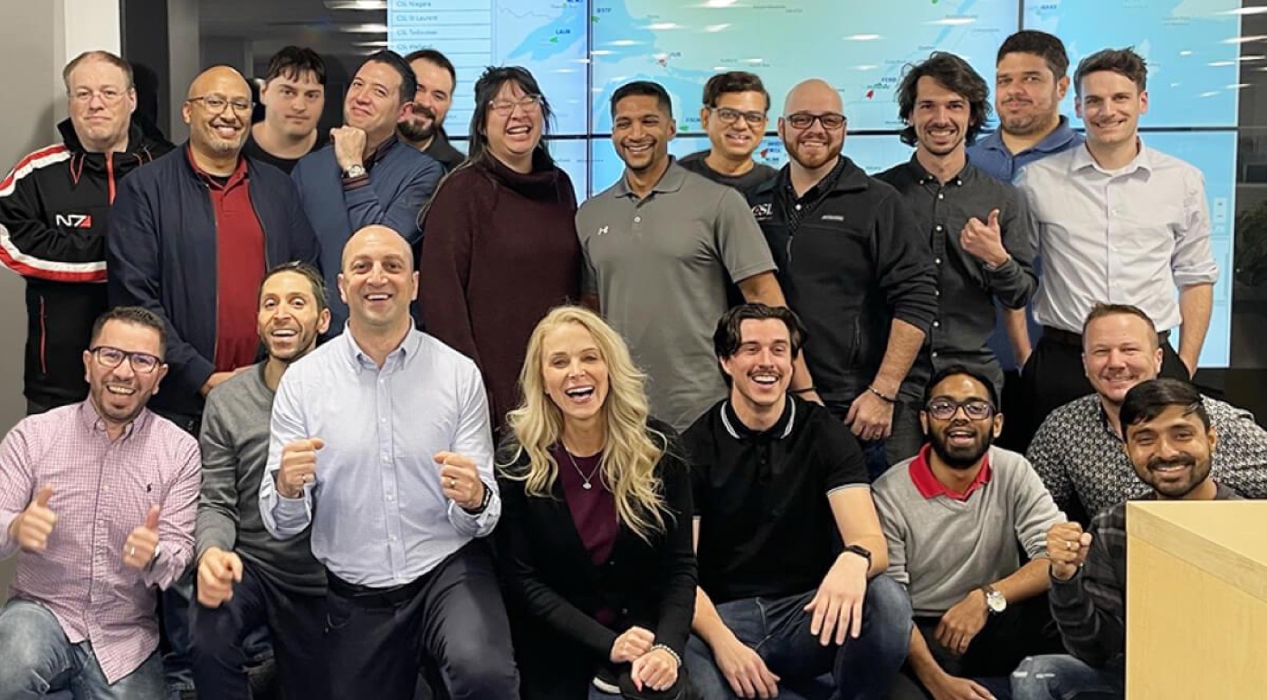 Jean Fahmy with colleagues in a collaborative technology team