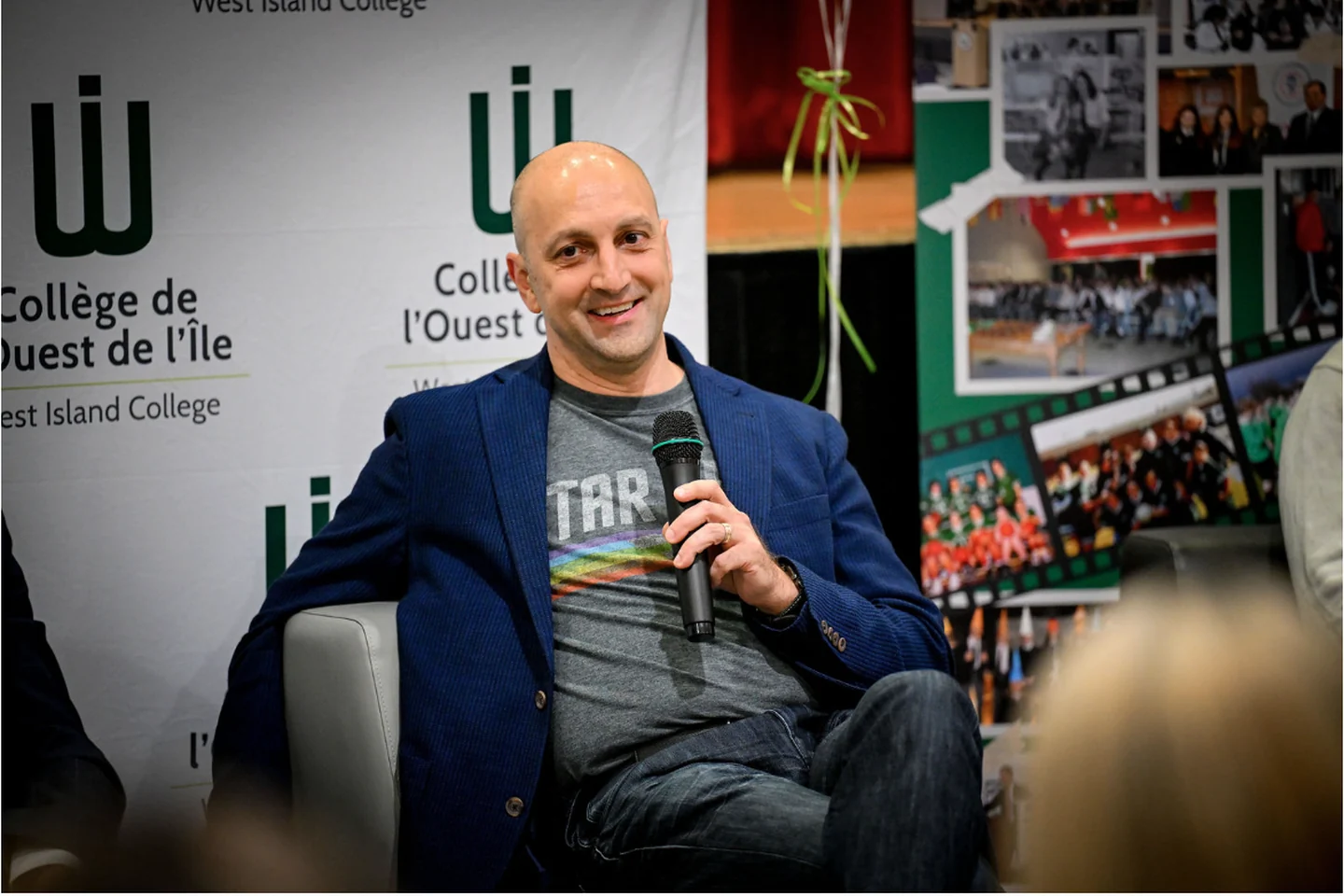Jean Fahmy speaking in a Star Trek shirt at West Island College